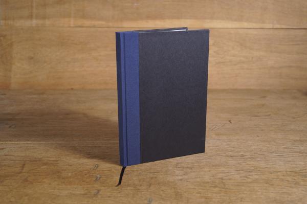 Writing and notebook black, with marine blue linen